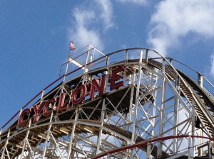 The Cyclone towers over the Coney Island boardwalk in Brooklyn at the corner of Surf and Stillwell.
